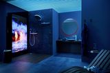 In blaues Licht getauchtes, offenes Badezimmer mit Smart-Home-Lösungen von Hansgrohe