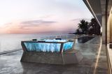 Glaswhirlpool auf einer luxuriösen, weitläufigen Terrasse mit Blick aufs offene Meer