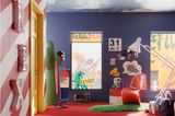 Buntes Jugendzimmer mit blauen Wänden, roten Möbeln und Teppich und gelber Tür